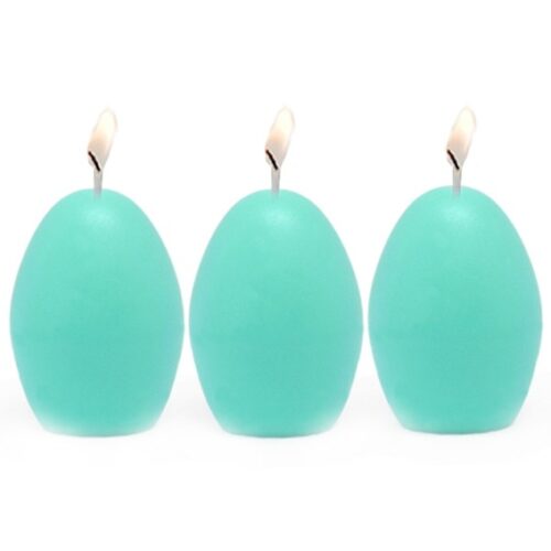 Velas azules con forma de huevo hechas con el molde para velas 3 huevos.